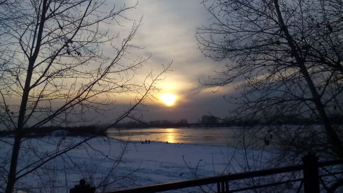 Scenic view of lake against sky during sunset