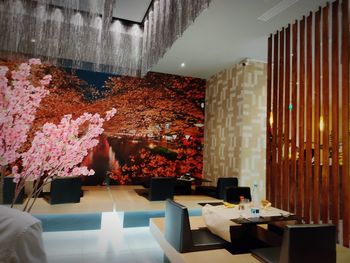 Flower vase on table in illuminated building