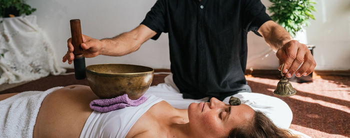 Therapist massaging customer in spa