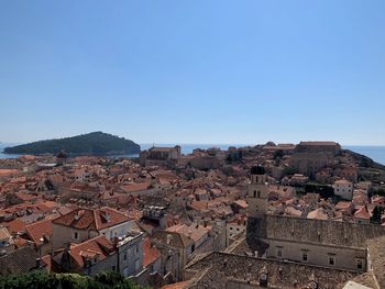 High angle view of townscape against clear blue sky