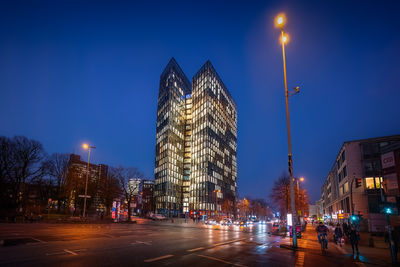 Illuminated buildings in city at night