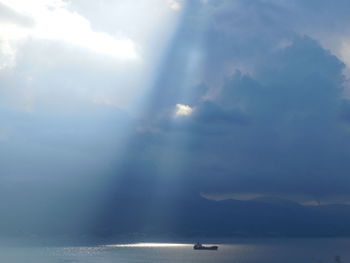 Scenic view of sea against cloudy sky