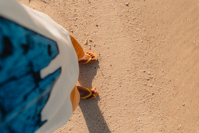 High angle view of footprints on sand