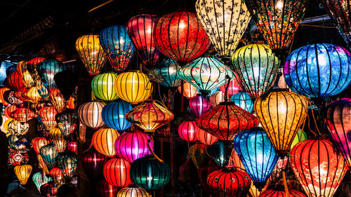 Full frame shot of illuminated lanterns hanging at night
