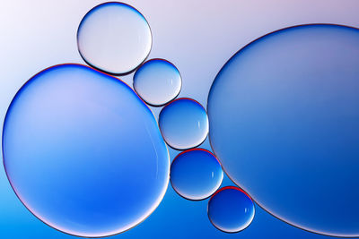 Low angle view of balloons against blue sky