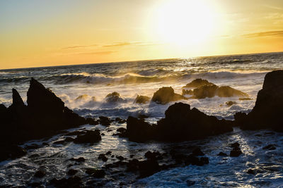 Scenic view of sea against sky during sunset