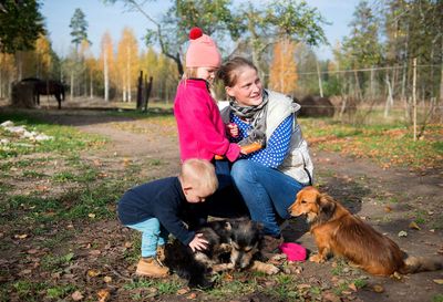 Woman with dog and son