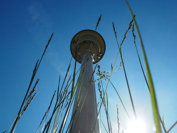 Low angle view of street light against clear blue sky