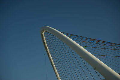 Low angle view of modern office building against blue sky