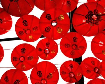 Low angle view of red lanterns hanging from ceiling