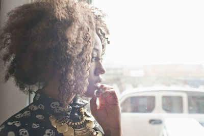 Portrait of young woman in car