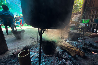 Man standing on barbecue grill