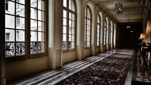 Empty corridor along pillars
