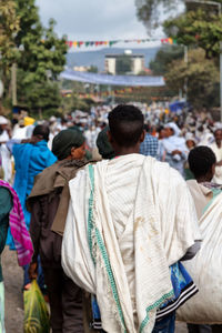 People on land against sky