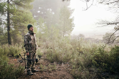 Man standing in forest