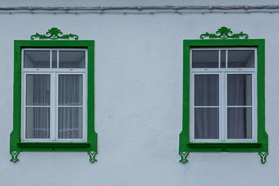 Closed window of white building