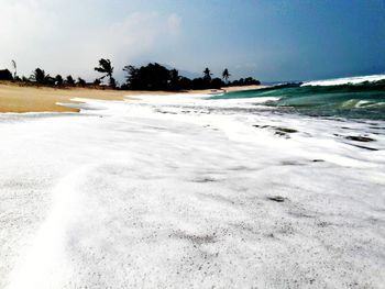 Scenic view of beach against sky