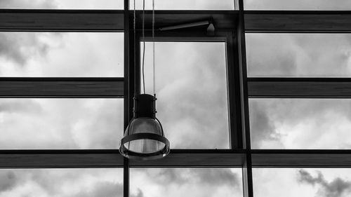 Low angle view of sky seen through glass window