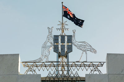 Low angle view of crane against clear sky