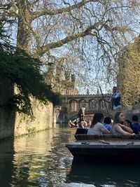 People sitting on riverbank