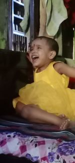 Rear view of cute baby girl