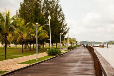 View of pathway next to sea