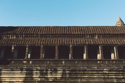 Low angle view of old building against blue sky