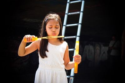 Girl blowing bubbles