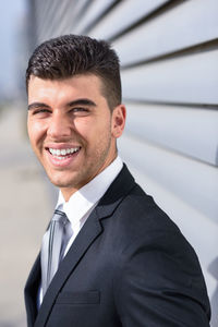 Portrait of happy young businessman