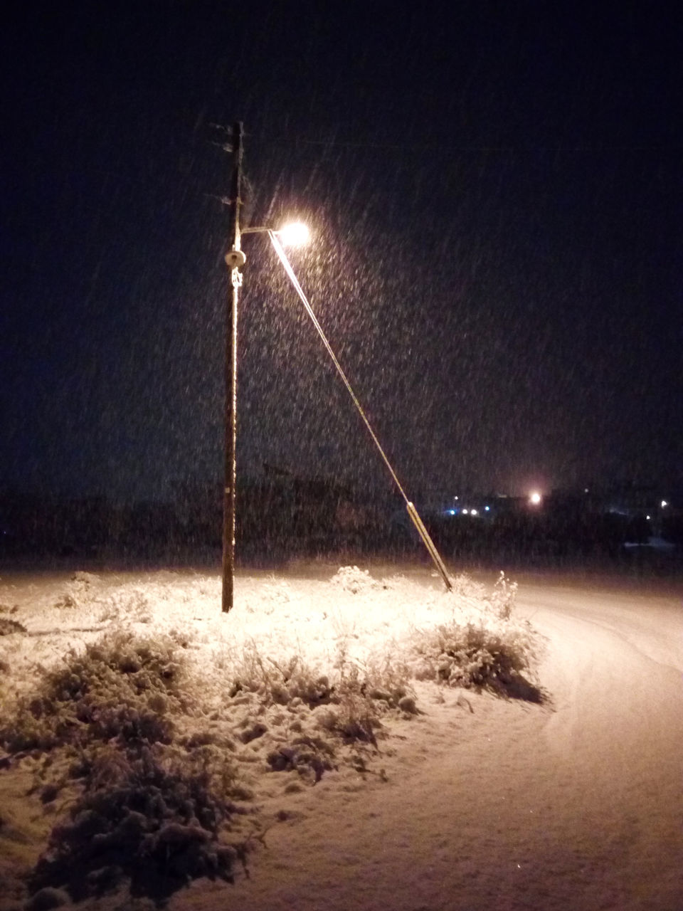 VIEW OF SWING AT BEACH AT NIGHT