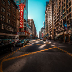 City street and buildings against sky