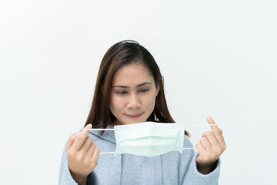 Portrait of a beautiful young woman over white background