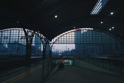 Illuminated railroad station in city