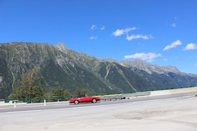 Scenic view of mountains against blue sky