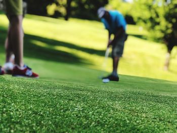 Low section of person on golf ball