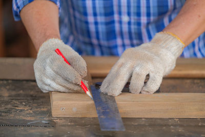 Close-up of man working on table