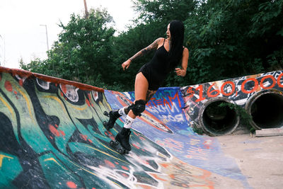 Full length of man skateboarding on skateboard