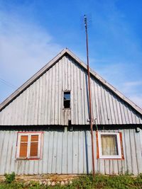 Low angle view of old house against sky