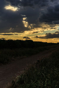 Scenic view of dramatic sky over land