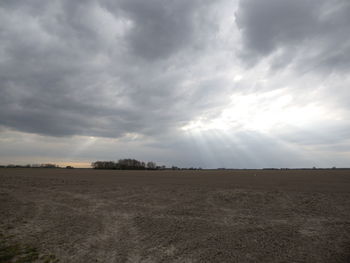 Scenic view of landscape against cloudy sky