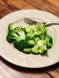 Close-up of broccoli in plate on table