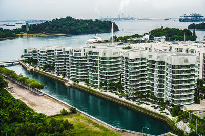 High angle view of river amidst buildings in city