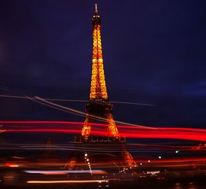 Low angle view of illuminated tower at night