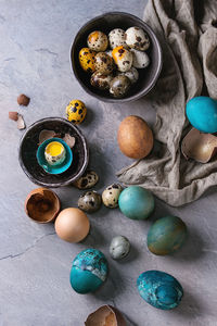 High angle view of multi colored eggs on table