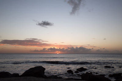 Scenic view of sea at sunset