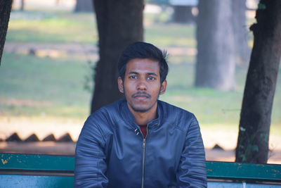 Portrait of young man standing outdoors