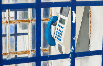 Close-up of telephone at booth