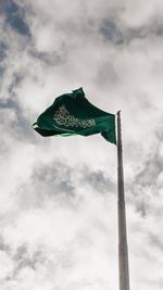 Low angle view of flags against the sky