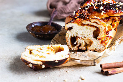 Swirl brioche with apricot jam, nuts, cinnamon and anise star. braided or roll bread, babka.