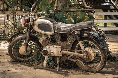 Abandoned motorcycle on land
